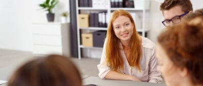 Business team engaged with executive coaching program