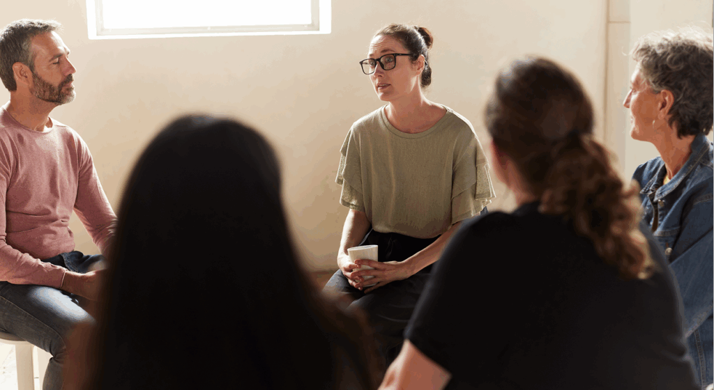 Team coach facilitating conflict resolution in the workplace