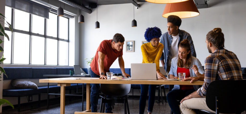 Team discussing how to create a coaching strategy